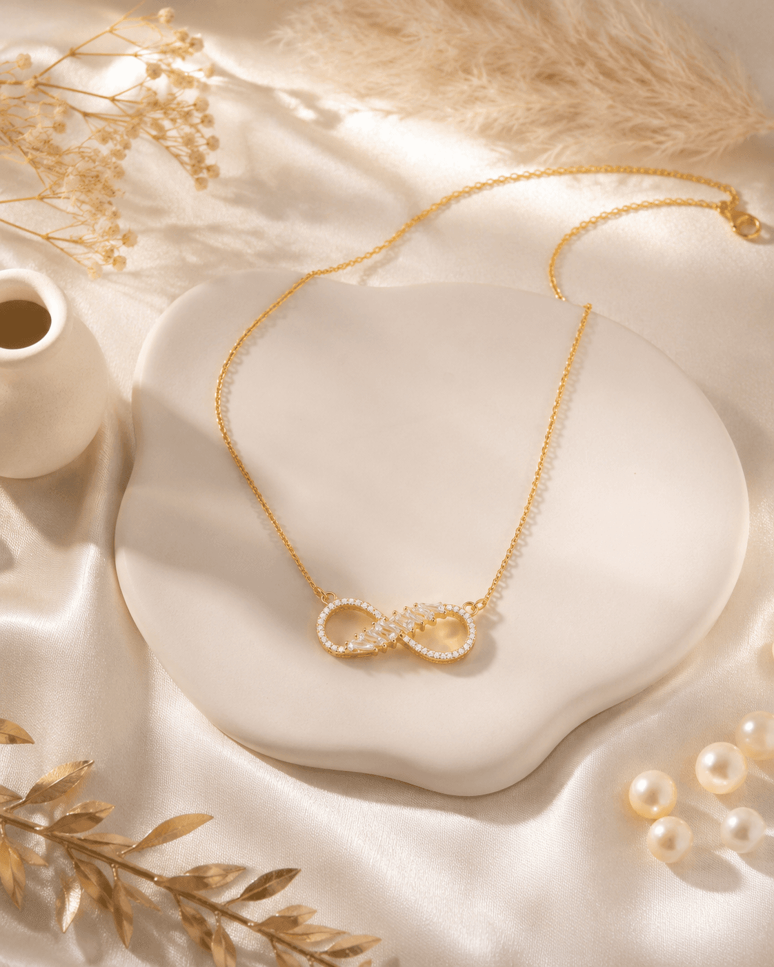 Women’s stainless steel necklace featuring a crystal infinity pendant